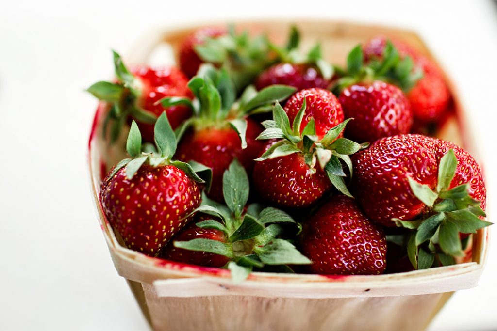 a basket full of strawberries, one of the delicious and healthy foods forbidden by low-carb and keto diets