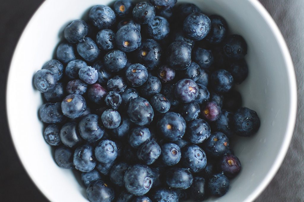 blueberries in a bowl, a delicious source of healthy carbs